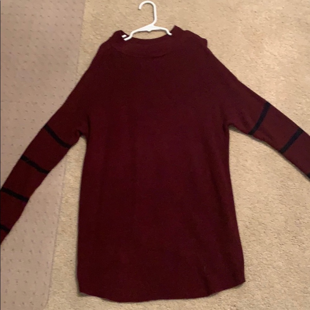Maroon sweater with black stripes on the sleeves
